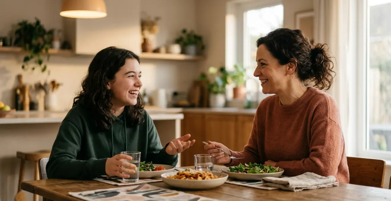 A warm, candid family dinner moment capturing genuine connection between parent and teenager